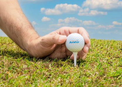 aviator zone golf ball placed on tee surrounded by grass